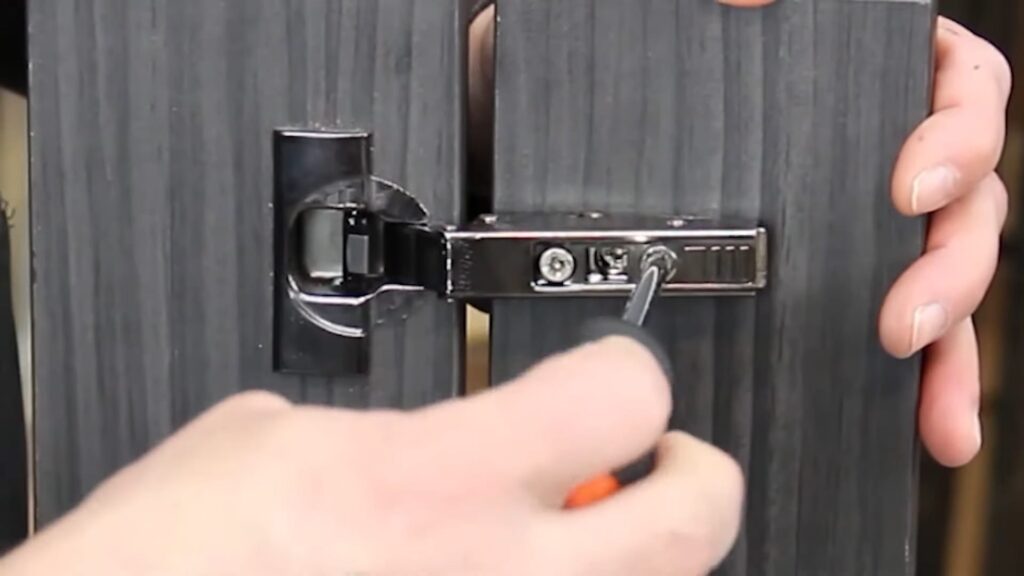 Adjusting cabinet hinges in and out